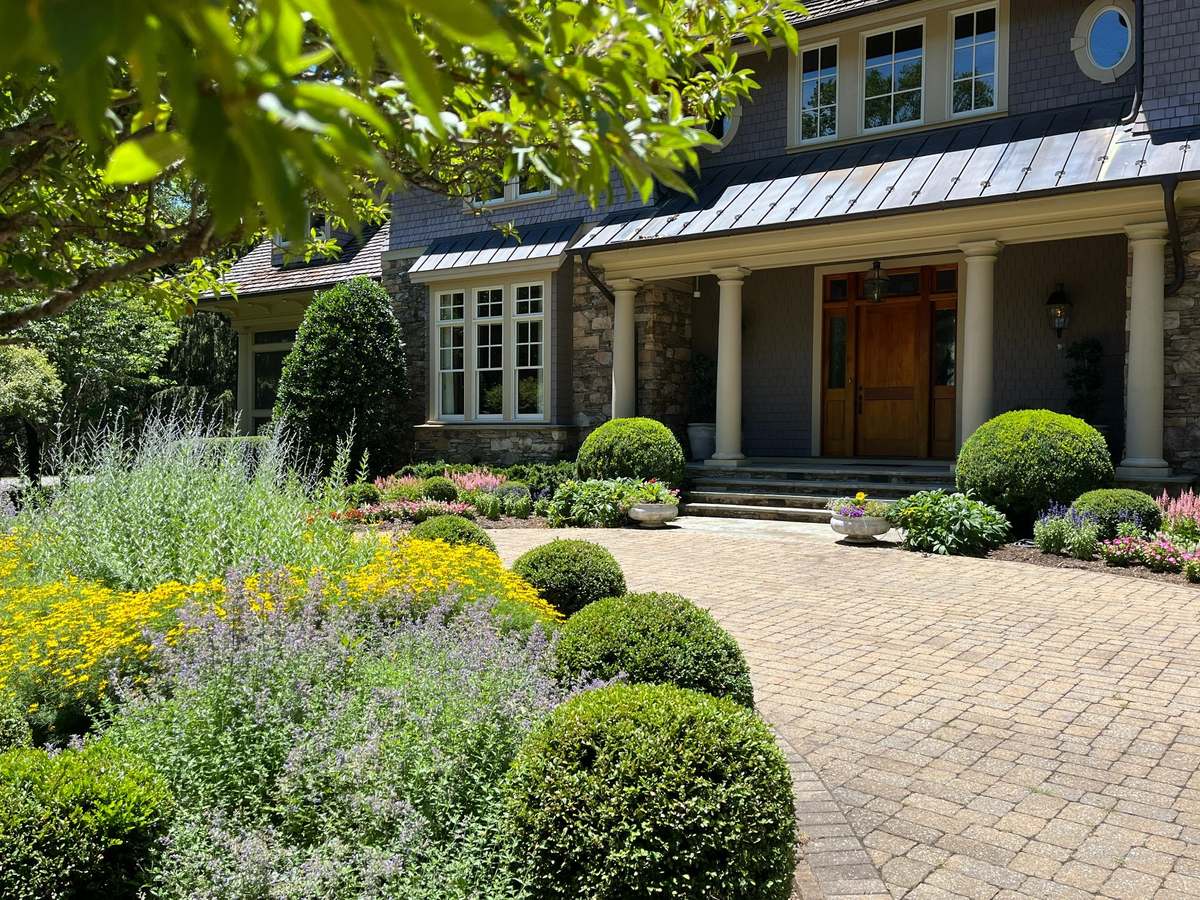 Dense turf and established perennial borders on an irrigated residential property